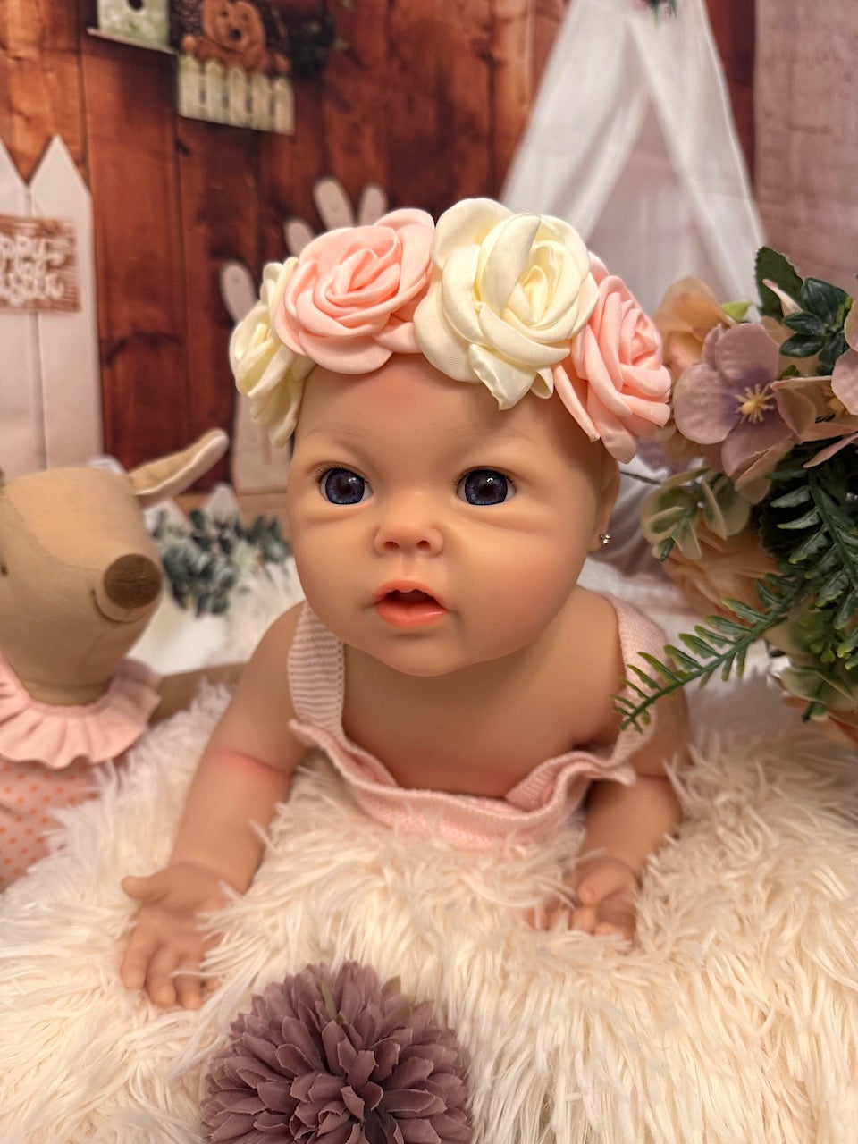 Bebe reborn con lazo flores