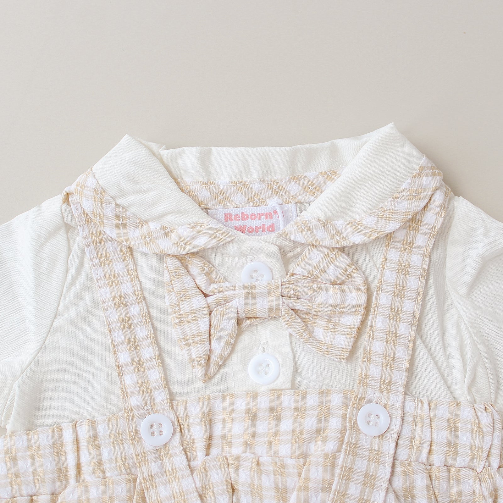 Peto de cuadros con camisa y pajarita - Para bebés reborn de 44 a 52 cm