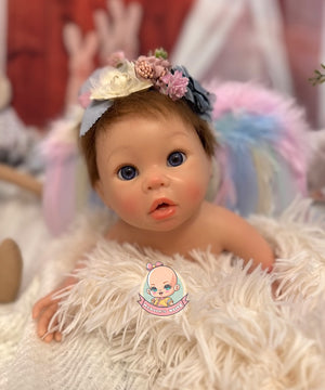 bebe reborn con pelo injertado natural