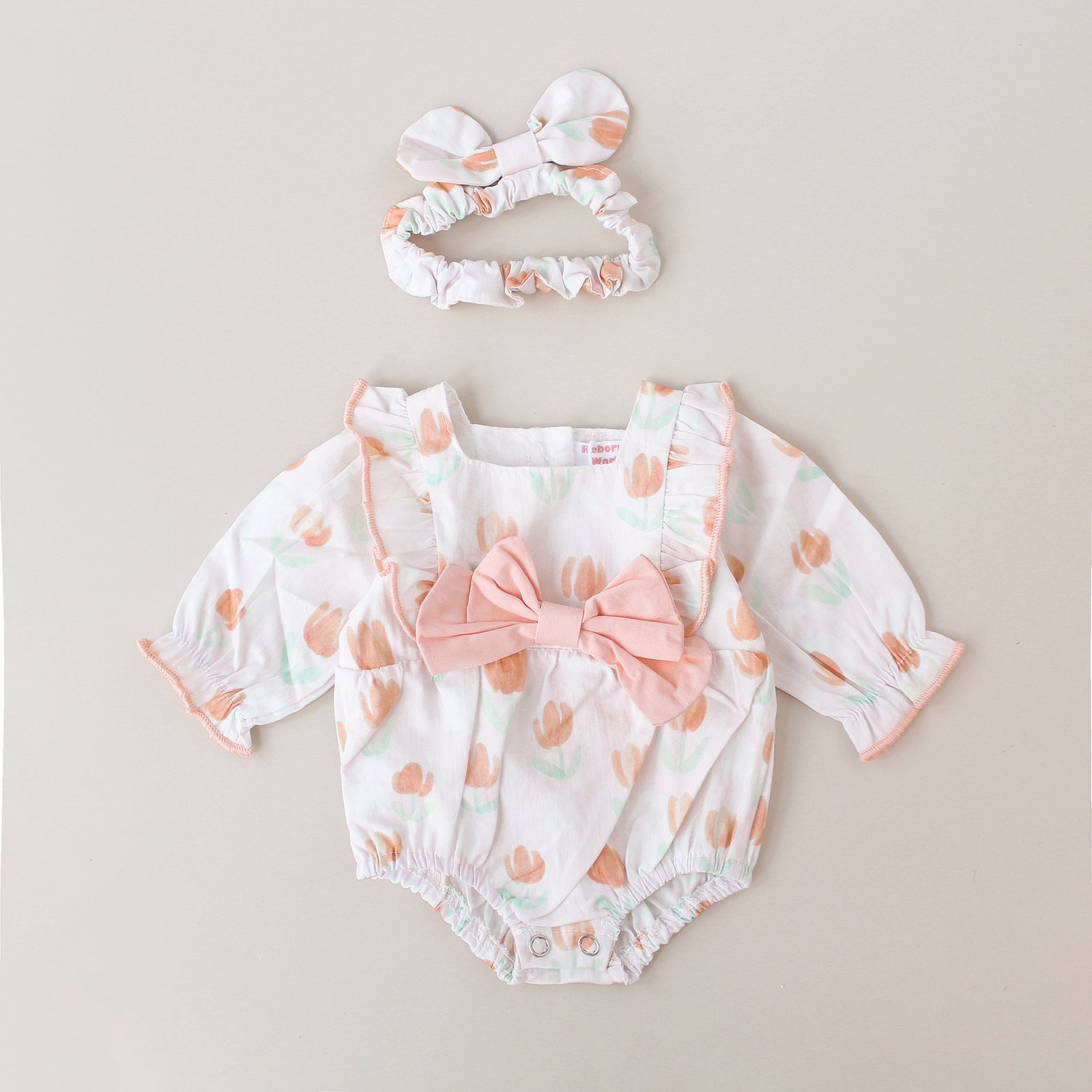 Pelele flores y volantes con lazo – Para bebés reborn de 44 a 52 cm