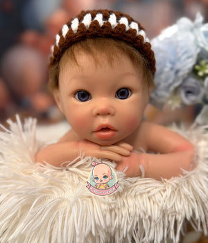 muñeca de silicona con caida de cabeza