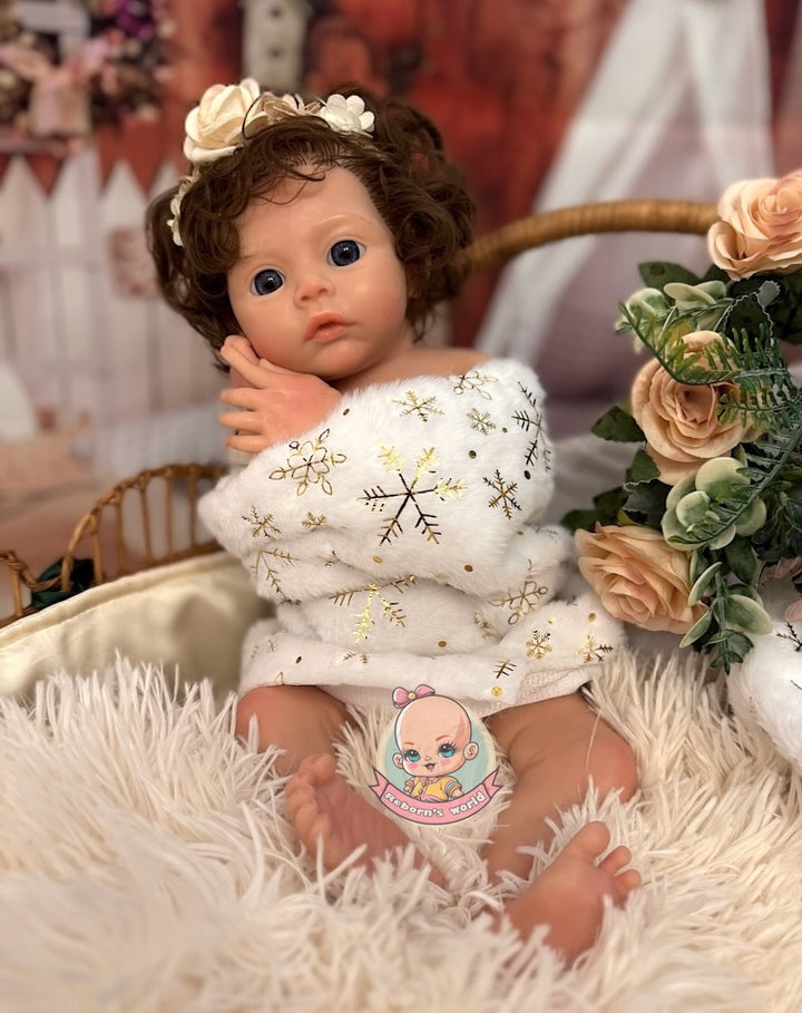 muñeca reborn con pelo y brazos juntos