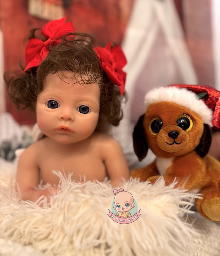 muñeca reborn con pelo y peluche