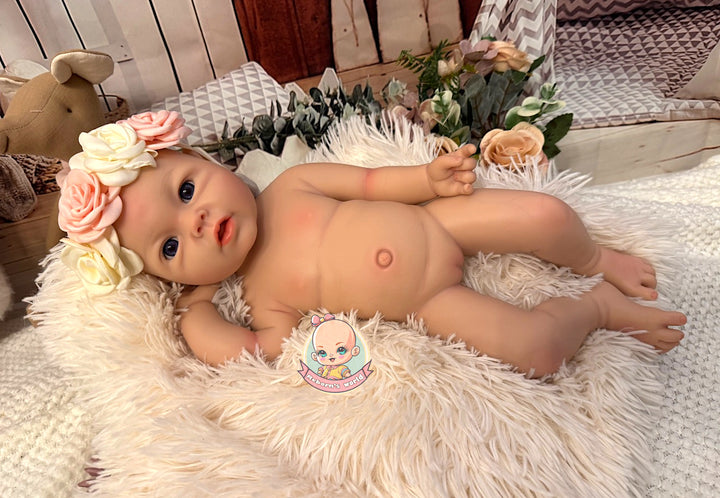 Muneca reborn leslie silicona blanda tumbada flexionada