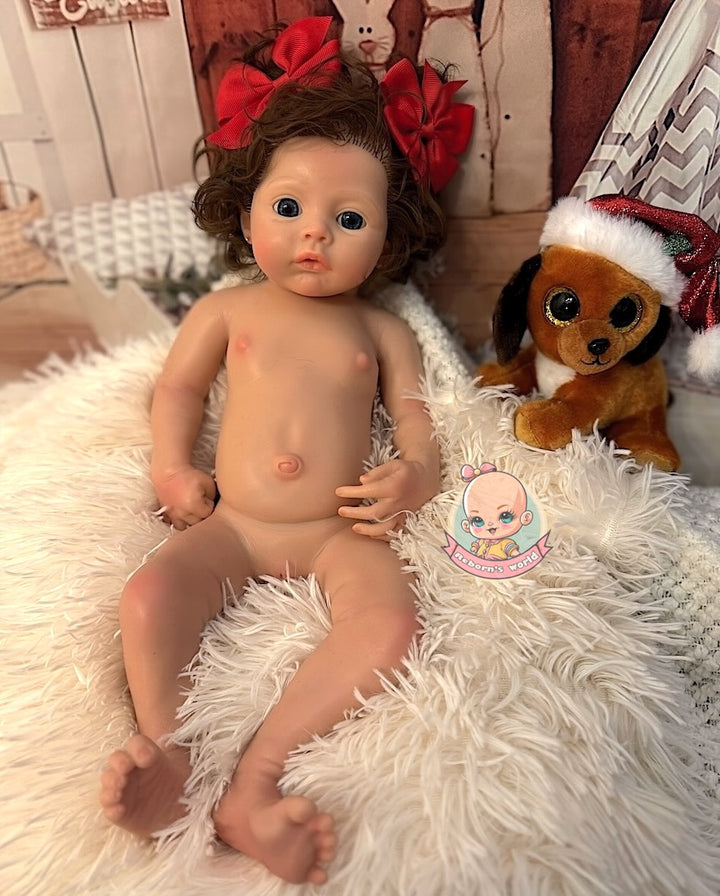 muneca reborn silicona con pelo sentada y perrito