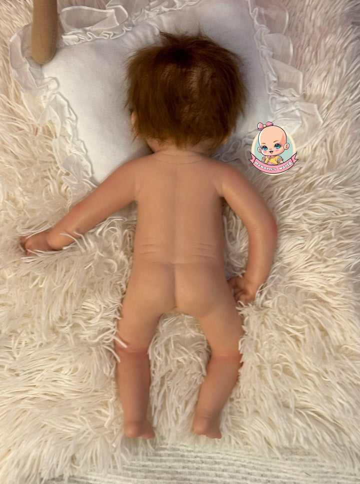 muñeca reborn silicona en cuna tumbada Bimba