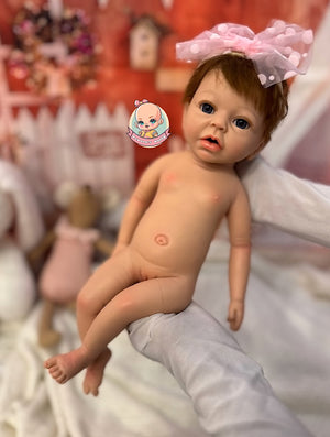 muñeca reborn silicona pelo injertado en brazos con lazo Noa