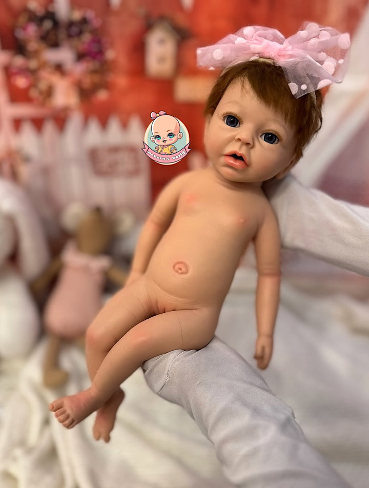 muñeca reborn silicona pelo injertado en brazos con lazo Noa