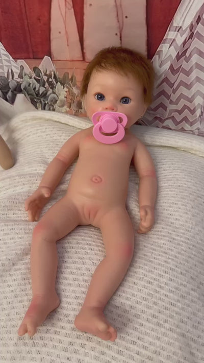 bebe reborn con pelo natural